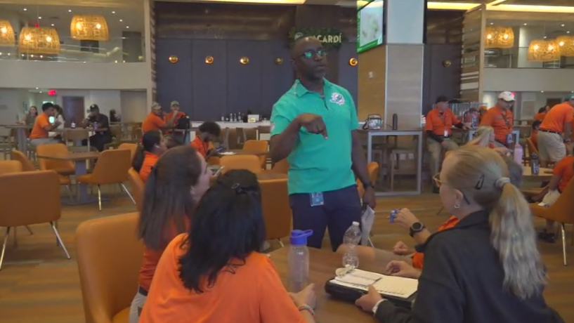 Miami Dade College professor finds his passion with side job at Hard Rock Stadium — CBS Miami, Odessa Arts news